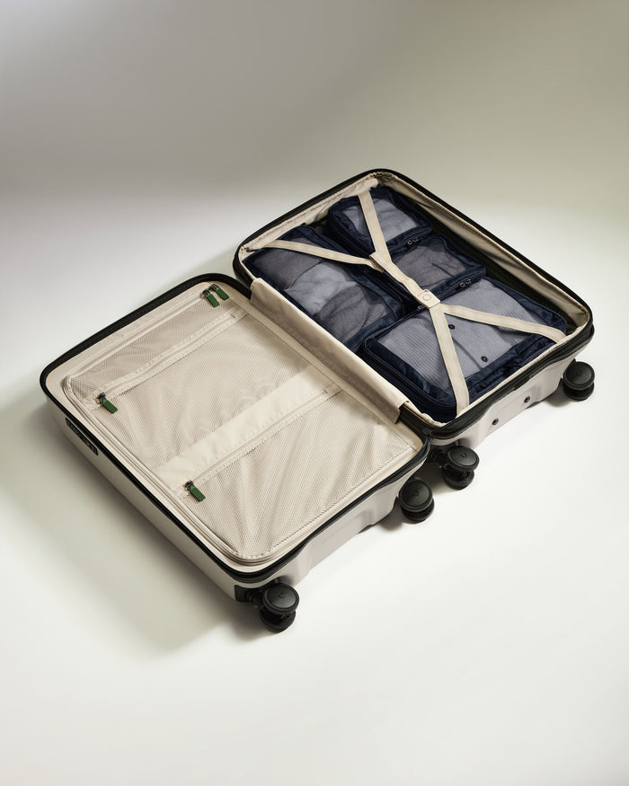 a suitcase with a few pieces of clothing