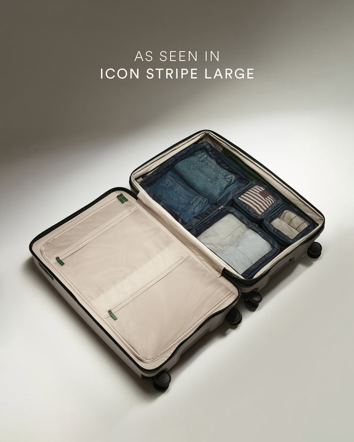 a suitcase with wheels and a few items inside