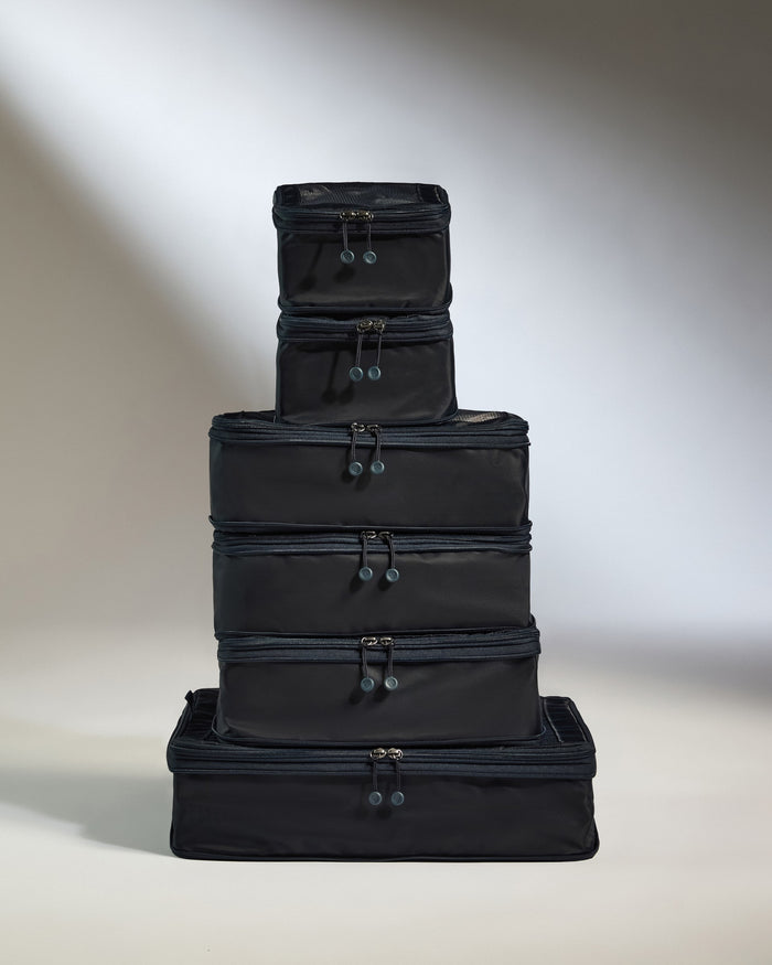 a stack of black bags