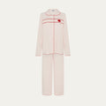 Pink pajama set with red stitching on a white background