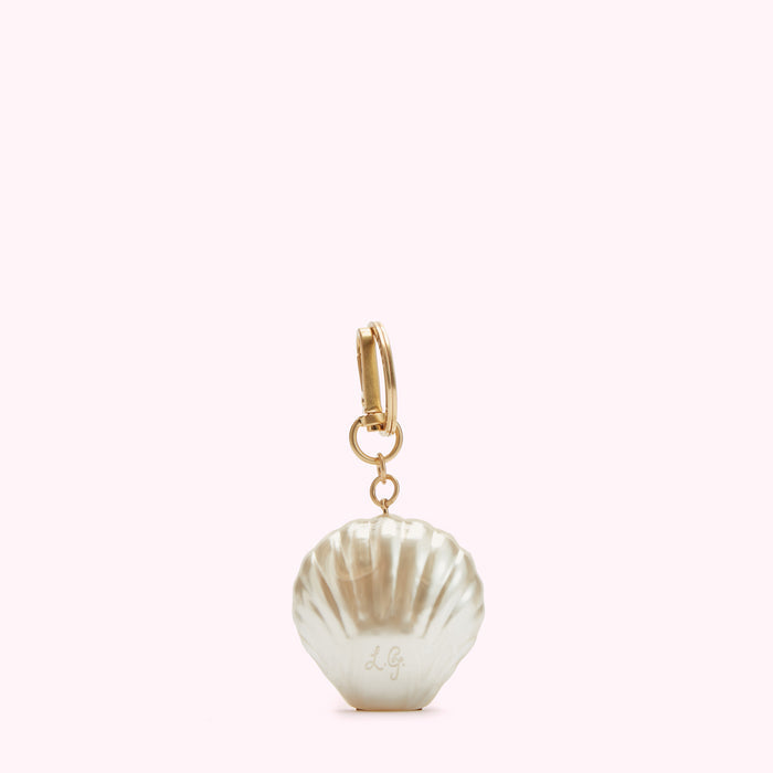 Gold keyring with a pearl-like seashell charm. The charm has the initials LG engraved on it.