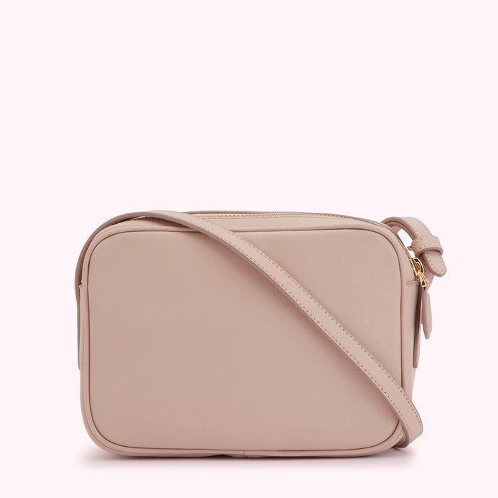 Pale pink leather crossbody bag with gold zipper.
