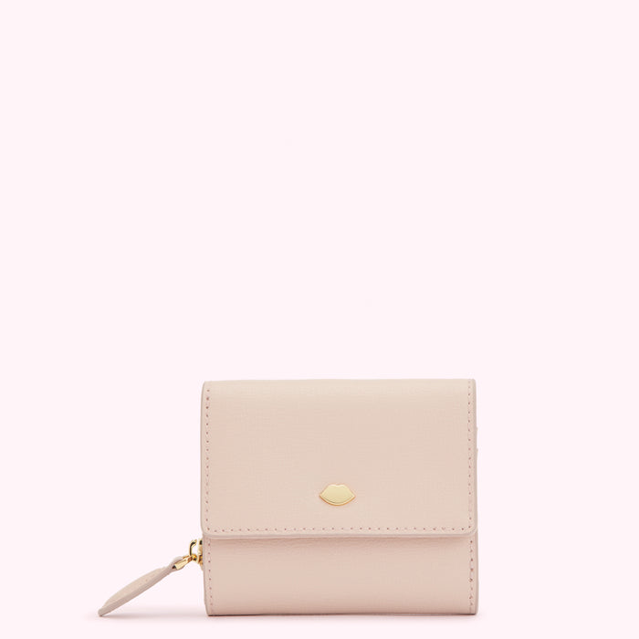 Pale pink leather wallet with gold lip detail against a white background.