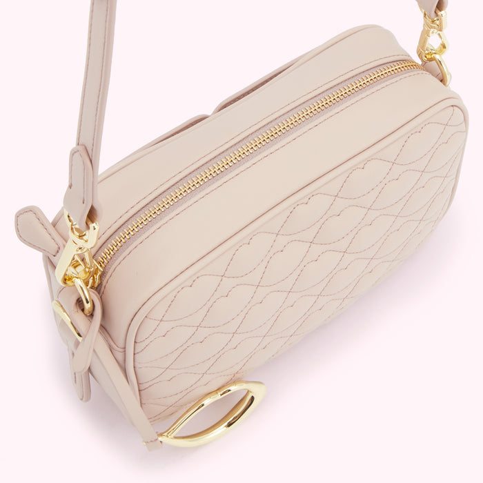 Beige quilted crossbody bag with gold-toned hardware.