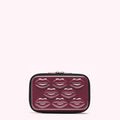 Burgundy rectangular makeup bag with embossed lips.