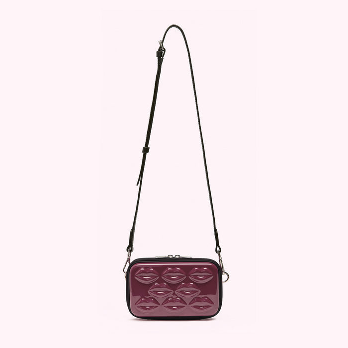 Burgundy crossbody bag with a lip-shaped pattern.
