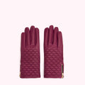 Pair of quilted purple leather gloves with gold zippers.