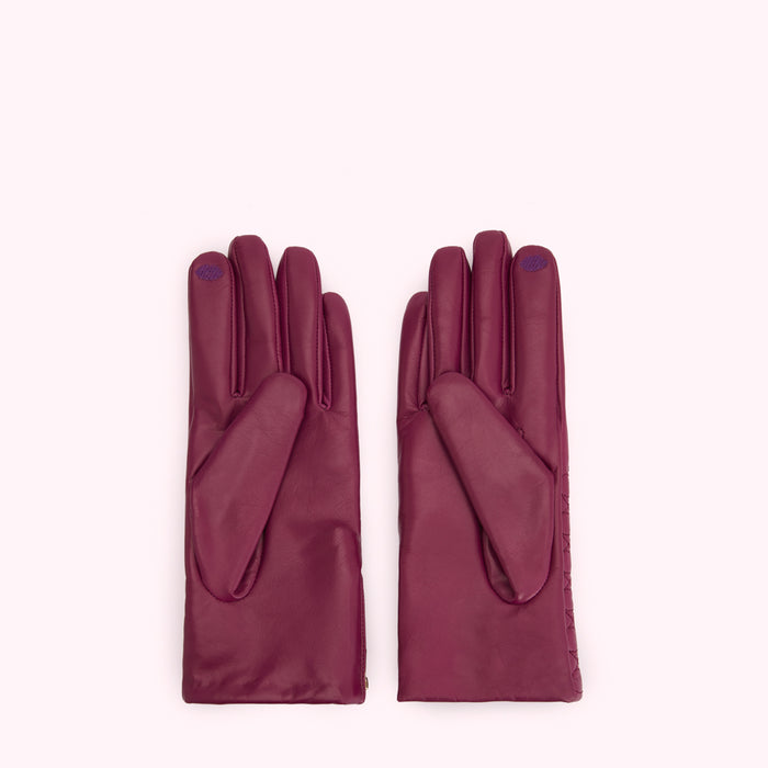 Pair of dark purple leather gloves on a white background.