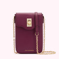Burgundy Lulu Guinness crossbody bag with gold chain strap and clasp.