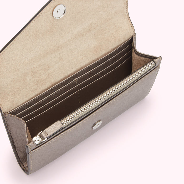 Open taupe leather wallet with zipper closure and multiple card slots.