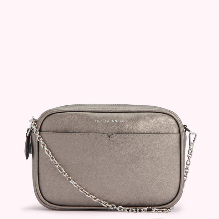 Silver Lulu Guinness crossbody bag with chain strap.