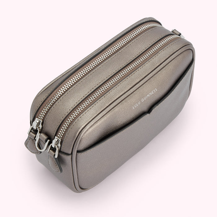 Gunmetal grey Lulu Guinness crossbody bag with double zippers.