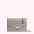 Silver metallic clutch with a silver lip detail and a thin silver chain strap against a white background.