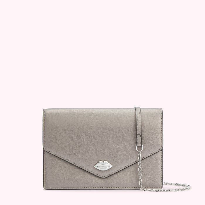 Silver metallic clutch with a silver lip detail and a thin silver chain strap against a white background.