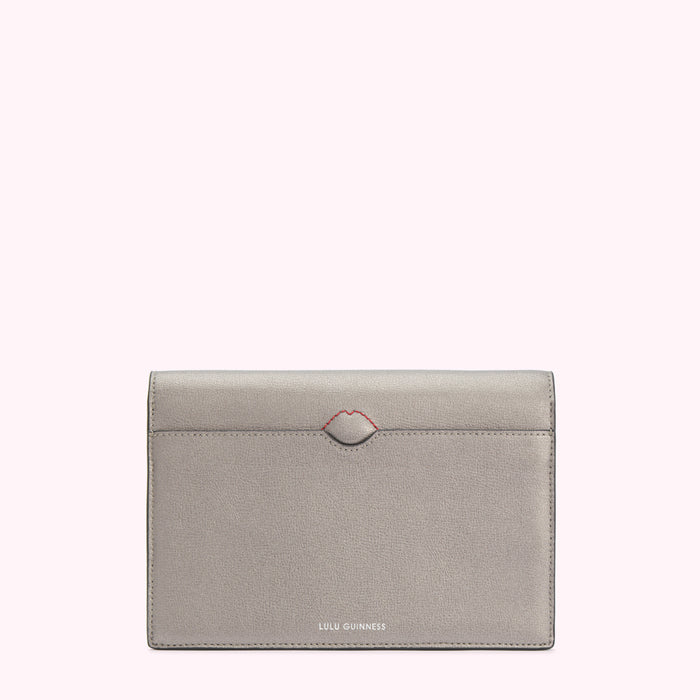 Silver Lulu Guinness wallet with a red lip detail.