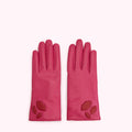 Pair of pink leather gloves with red lip cutouts.