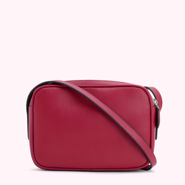 Red leather crossbody bag on a white background.