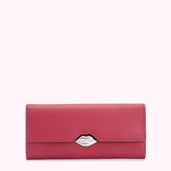 Pink leather wallet with a silver lip-shaped clasp against a white background.