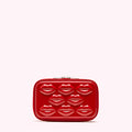 Red rectangular cosmetic case with embossed lips.