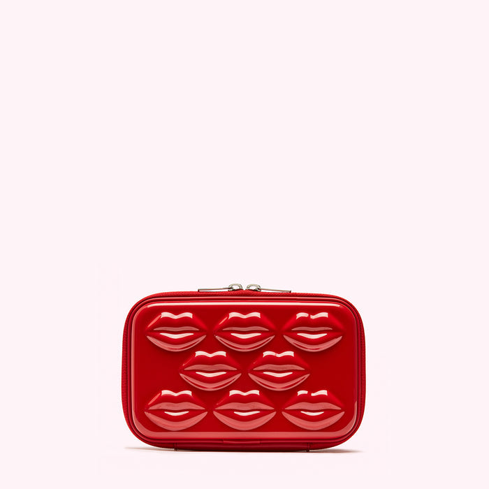 Red rectangular cosmetic case with embossed lips.