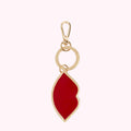 Gold Lulu Guinness keyring with red lip charm.