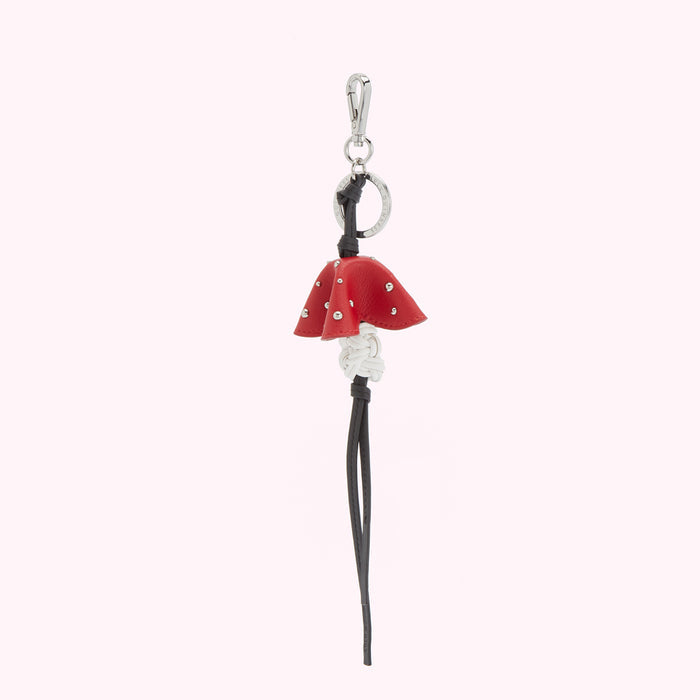 Red leather keyring with silver studs and black and white braided leather strap.