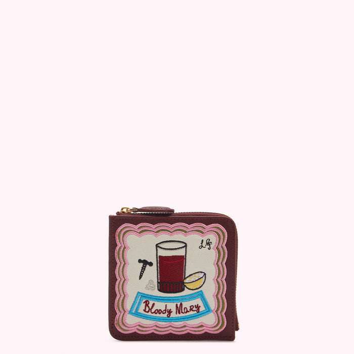 Burgundy leather zip-around wallet with embroidered Bloody Mary cocktail design.