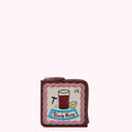 Burgundy leather zip-around wallet with embroidered Bloody Mary cocktail design.