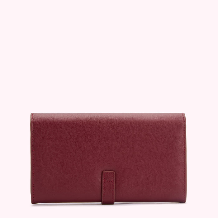 A burgundy leather wallet on a white background.