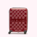 Red Lulu Guinness suitcase covered in embossed lips.