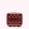 Red Lulu Guinness makeup case with lips design.