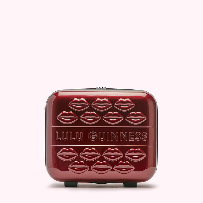 Red Lulu Guinness makeup case with lips design.
