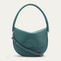 Teal Lulu Guinness crescent bag with a braided top handle and three lips detail.