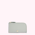 Light blue leather zip-around card holder with gold zipper and logo.