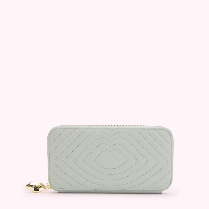 Light green quilted zip-around wallet with lip-shaped pattern and gold lip charm.