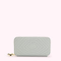 Light green quilted zip-around wallet with lip-shaped pattern and gold lip charm.