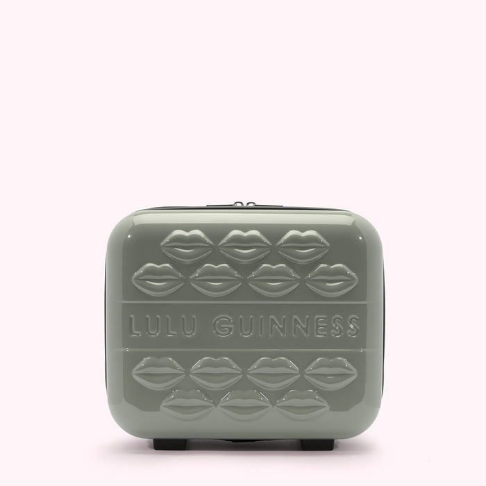 Sage green Lulu Guinness makeup case with embossed lips.