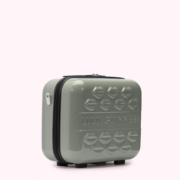 Sage green Lulu Guinness makeup case with embossed lips and the brand name.