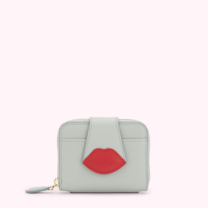 Light blue leather wallet with a red lip detail.