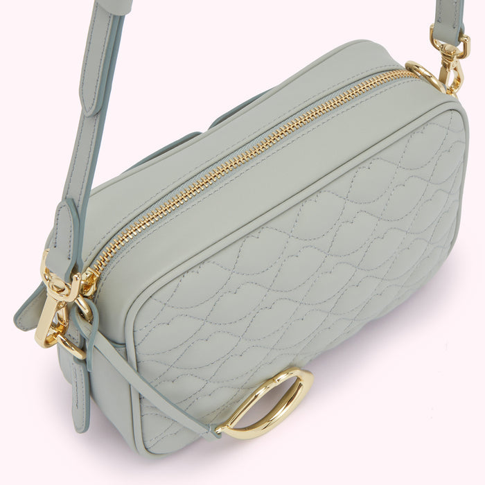 Light blue quilted leather crossbody bag with gold hardware.
