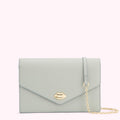 Light teal leather clutch with gold lip detail and chain strap.