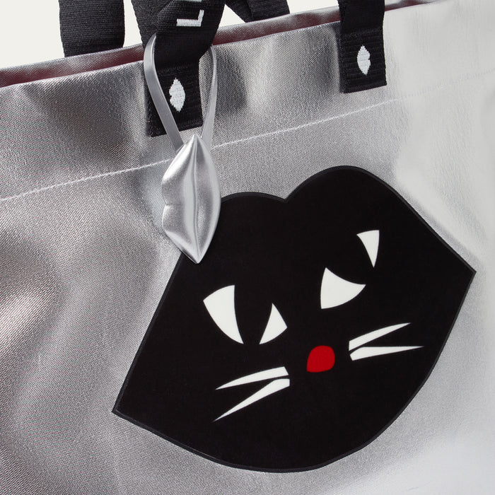 Silver tote bag with a black cat face design on a white background