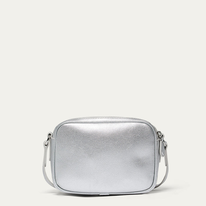 Silver crossbody bag on a light gray background