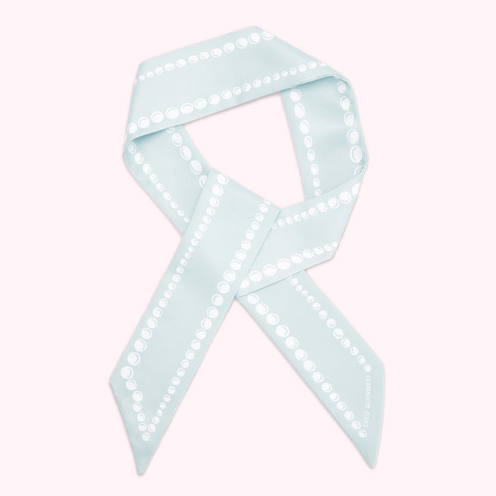 Light blue silk scarf with a pearl pattern. The Lulu Guinness logo is visible on the bottom right.