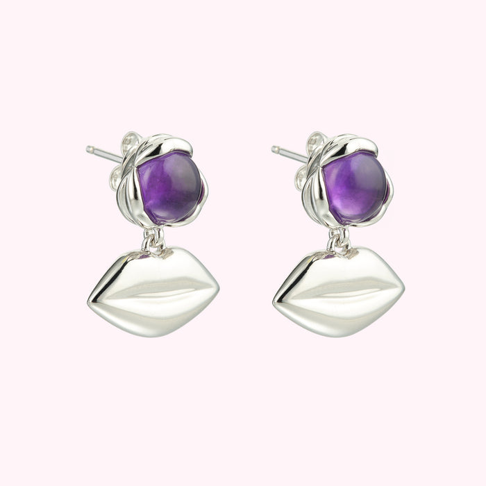 Silver lip earrings with amethyst stones.