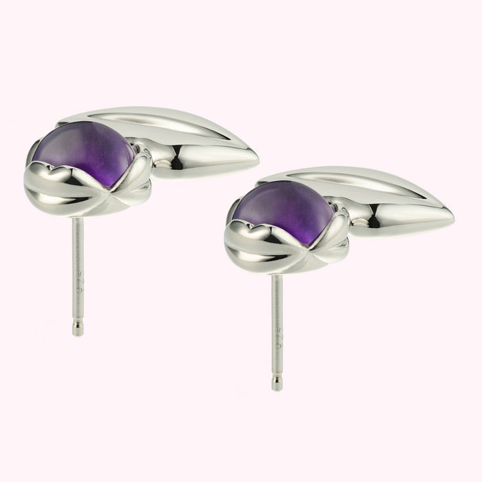 Pair of silver amethyst stud earrings.