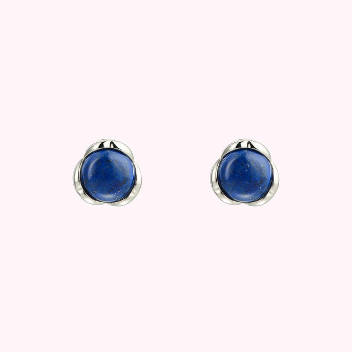 Pair of lapis lazuli stud earrings with silver settings.