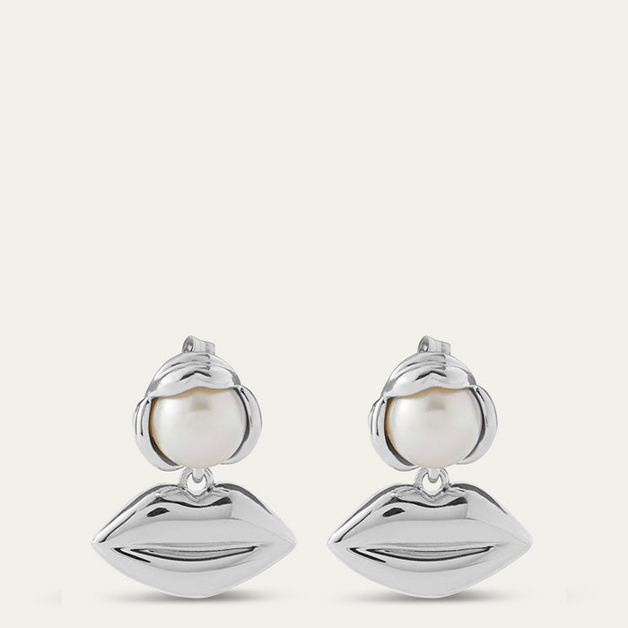 Silver lip pendant drop earrings with pearls on a white background