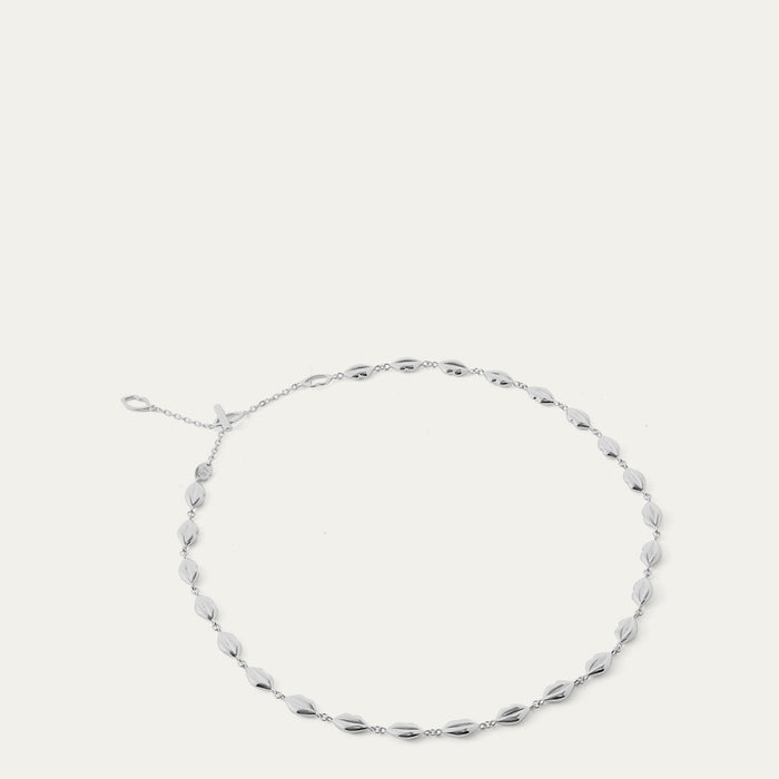 Silver lip chain necklace on a white background