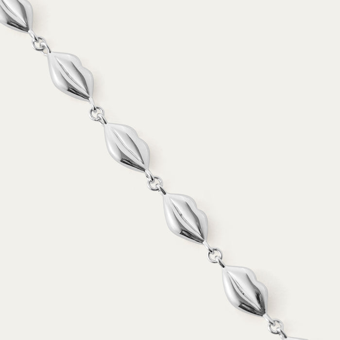 Silver lip chain necklace on a white background